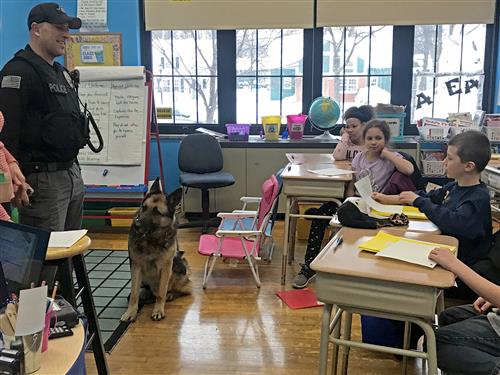 Officer Costello and Tank in front of class 