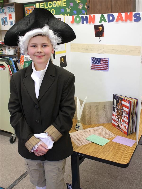 Student teaches guests about John Adams 