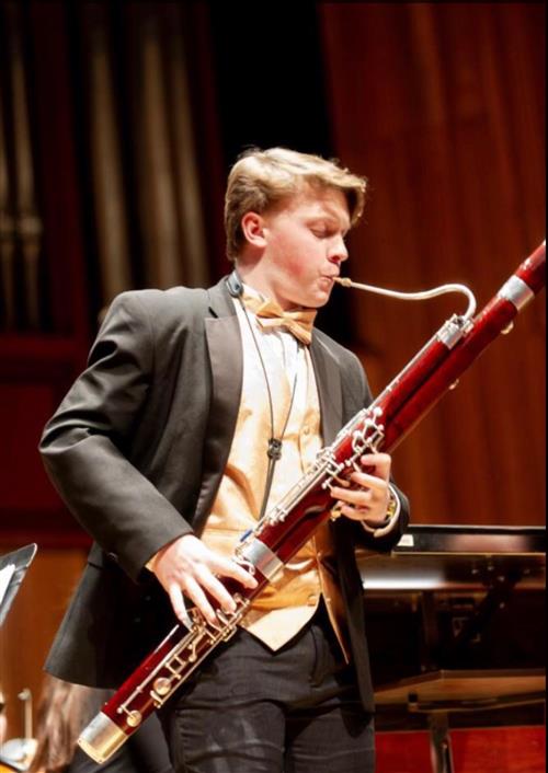 A.J. Neubert playing the bassoon 