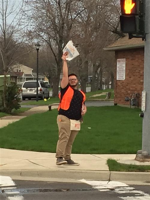 Student holding newspaper 