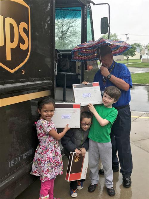Students next to UPS truck Students next to UPS truck
