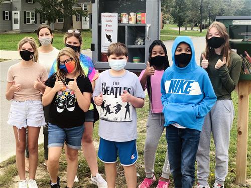 Students in front of food pantry