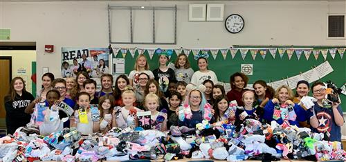 Students with donations of socks 