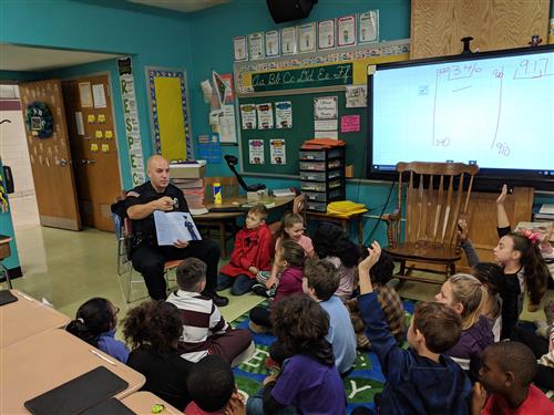 Officer reading to class 