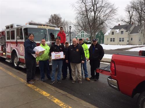 Firemen transporting donations 