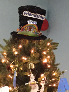 Decorative hat at the top of the tree with the words "Friendship Tree" 