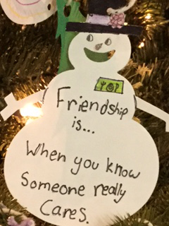 Snowman cut-out with friendship message written on it 
