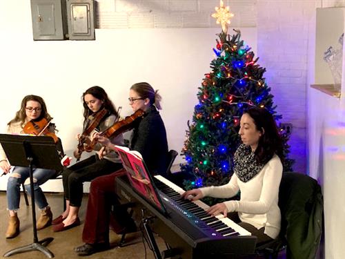 Kenmore East Orchestra students perform at the Vive Refugee Shelter Kenmore East Orchestra students perform at the Vive Refugee Shelter