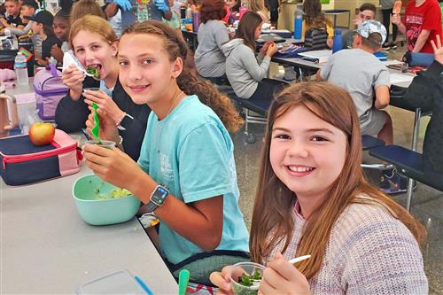 Students sample a new salad recipe made from kale grown in NYS.