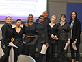  Students pose in their culinary outfits at a special luncheon.