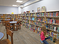  students pick out books in the new Edison Elementary library