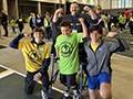  student and athletes flex muscles and pose at athletic competition