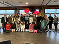 students pose and smile as they welcome students from Germany