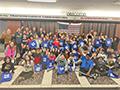  Holmes students hold up special bags from UB student athlete Kiara Johnson