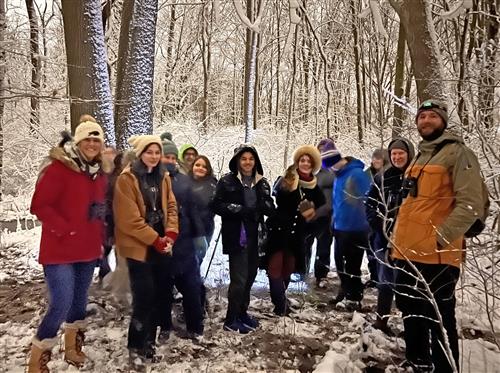 Students pose in the woods