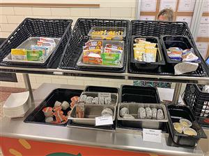 breakfast food sorted on a cart