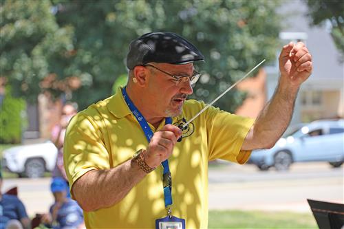  Kenmore East band director Phil Aguglia directs his students during a summer camp session