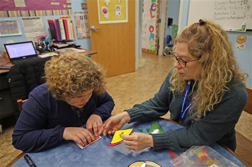 Teacher works with visually impaired student