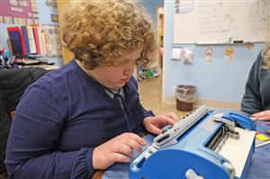 Student types Braille