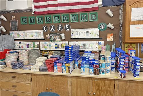 A shelf full of birthday treats and decorations.