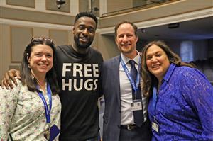 Ken Nwadike Jr. poses with Kenmore West staff