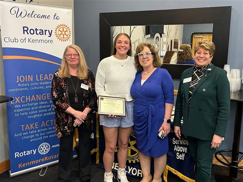 Ken West student poses with assistant principal and others with a scholarship award