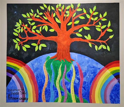 mural showing a tree on top of the world with colors around it