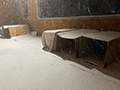  cardboard boxes outside on a snowy night