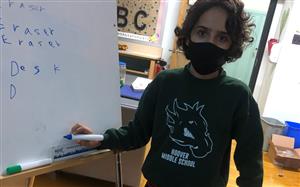student in hms sweatshirt