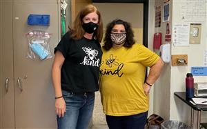Two teachers wearing kindness shirts