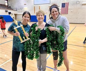 admin with the volleyball trophy
